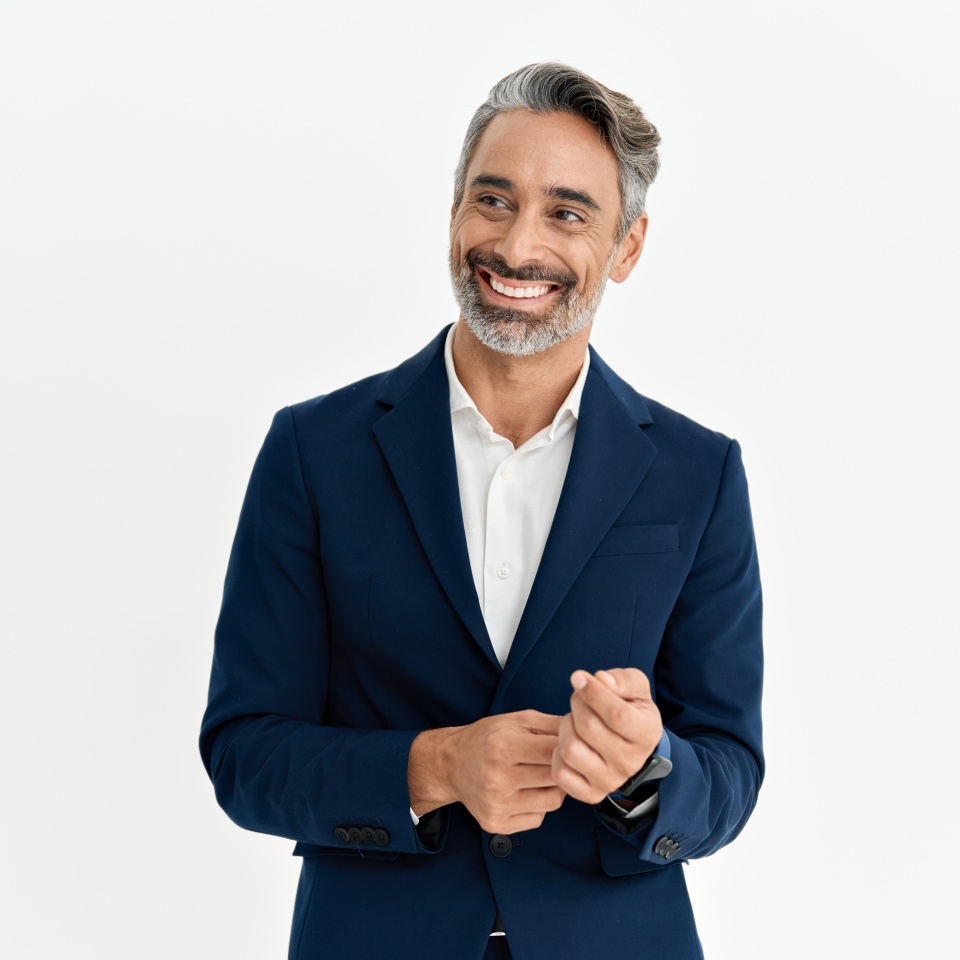 Happy middle aged business man leader, smiling stylish mature professional executive, confident businessman or fashion model wearing suit looking away standing isolated white background, portrait.